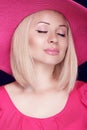 Beauty. Fashionable pretty blond woman with makeup wearing in pi Royalty Free Stock Photo