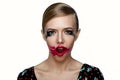 Beauty female Model with smeared red Lipstick on open Mouth. Royalty Free Stock Photo
