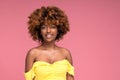 Beauty female portrait of smiling happy afro hairstyle girl in glamour summer makeup. Pink background Royalty Free Stock Photo