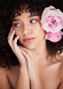 Beauty, flowers and face of woman with makeup, cosmetics and hair care for wellness, glamour and glow in studio. Salon