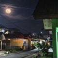 The beauty of the full moon shining on our small town Royalty Free Stock Photo