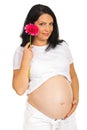 Beauty future mother holding flower Royalty Free Stock Photo