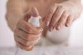 Beauty girl applying some white lotion on forefinger of her hand Royalty Free Stock Photo