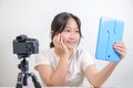 Beauty girl blogger concept, Asian girl llook in the mirror in live streaming on white Royalty Free Stock Photo