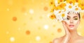 Beauty girl with daisy flowers hairstyle touching her skin Royalty Free Stock Photo