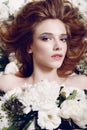 Beauty Girl With Flowers.Beautiful Model Woman Face. Perfect Skin. Professional Make-up.Makeup. Fashion Art