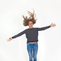 Beauty girl flying in jump with brown hair Royalty Free Stock Photo