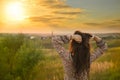 Beauty Girl Outdoors enjoying nature. Beautiful Model with long healthy blowing hair running on the Spring Field, Sun Royalty Free Stock Photo