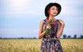 Beauty Girl Outdoors enjoying nature. Beautiful Teenage Model girl in dress on the Spring Field Royalty Free Stock Photo