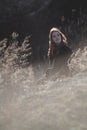 Beauty Girl Outdoors enjoying nature. Beautiful Teenage Model girl with long healthy blowing hair running on the Spring Field, Sun Royalty Free Stock Photo