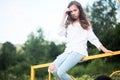 Beauty Girl Outdoors enjoying nature. Teenage Model girl running on the Spring Field, Sun Light. Royalty Free Stock Photo