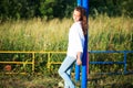 Beauty Girl Outdoors enjoying nature. Teenage Model girl running on the Spring Field, Sun Light. Royalty Free Stock Photo