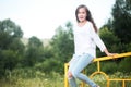 Beauty Girl Outdoors enjoying nature. Teenage Model girl running on the Spring Field, Sun Light. Royalty Free Stock Photo