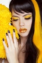 Beauty Girl Portrait with Colorful Makeup, Long Hair, Nail polish. Manicure and Hairstyle. Black and yellow Colors Royalty Free Stock Photo