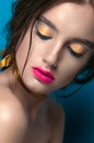 Beauty Girl Portrait with Vivid Makeup. Fashion Woman portrait close up on blue background. Bright Colors. Manicure Make up. Smoky Royalty Free Stock Photo