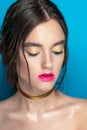 Beauty Girl Portrait with Vivid Makeup. Fashion Woman portrait close up on blue background. Bright Colors. Manicure Make up. Smoky Royalty Free Stock Photo