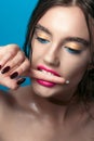 Beauty Girl Portrait with Vivid Makeup. Fashion Woman portrait close up on blue background. Bright Colors. Manicure Make up. Smoky Royalty Free Stock Photo