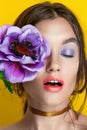 Beauty Girl Portrait with Vivid Makeup. Fashion Woman portrait close up on yellow background. Bright Colors. Manicure Make up. Smo Royalty Free Stock Photo