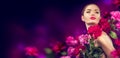 Beauty girl with purple, red, pink peony flowers portrait. Beauty high fashion model woman with peony flowers Royalty Free Stock Photo