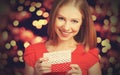 Beauty girl in red dress with gift box to Christmas or Valentine's Day Royalty Free Stock Photo