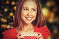 Beauty girl in red dress with gift box to Christmas or Valentine's Day Royalty Free Stock Photo