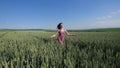 Beauty girl running on green wheat field. Freedom concept. Happy woman outdoors Royalty Free Stock Photo