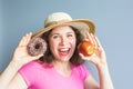 Beauty girl taking colorful donuts. Funny joyful woman with sweets, dessert. Diet, dieting concept. Junk food Royalty Free Stock Photo