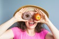 Beauty girl taking colorful donuts. Funny joyful woman with sweets, dessert. Diet, dieting concept. Junk food Royalty Free Stock Photo