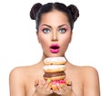 Beauty girl taking stack of colorful donuts