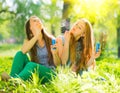Beauty girls blowing soap bubbles in spring park Royalty Free Stock Photo