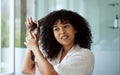 Beauty, hair and afro girl bathroom routine for curly texture style and grooming in mirror. Hair care, self care and Royalty Free Stock Photo