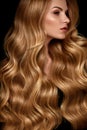 Beauty Hair. Beautiful Woman With Curly Long Blond Hair Royalty Free Stock Photo
