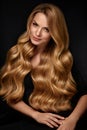 Beauty Hair. Beautiful Woman With Curly Long Blond Hair Royalty Free Stock Photo