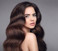 Beauty hair. Brunette girl portrait with long shiny wavy hair. B Royalty Free Stock Photo