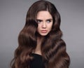 Beauty hair. Brunette girl portrait with long shiny wavy hair. B Royalty Free Stock Photo