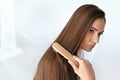 Beauty Hair Care. Beautiful Woman Brushing Long Healthy Hair Royalty Free Stock Photo
