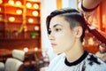 Beauty, hairstyle, treatment, hair care concept, young woman and hairdresser cutting hair at hairdressing salon. Hairdresser cuts Royalty Free Stock Photo