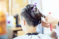 Beauty, hairstyle, treatment, hair care concept, young woman and hairdresser cutting hair at hairdressing salon. Hairdresser cutts Royalty Free Stock Photo