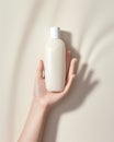 beauty hand in front of bottle cream.