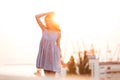 Beauty Happy Ginger girl in dress posing on the sunset Royalty Free Stock Photo