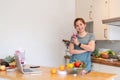 Beauty healthy asian woman making fruit smoothie with blender. woman drinking glass of fruit smoothie in kitchen. Diet Royalty Free Stock Photo