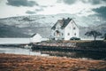 Beauty house on near by fjord in norway with the car and cabine for boat. Original wallpaper from north part of Europe Royalty Free Stock Photo