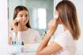 teenage girl cleaning face skin with cotton disc Royalty Free Stock Photo