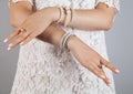 Beauty, jewelry and luxury concept - close up of beautiful. Woman bracelet and rings