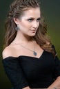 Beauty and Jewelry woman in black dress modern style with hairstyle and silver jewelry. Fashion brunet model with necklace