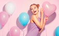 Beauty joyful teenage girl with colorful air balloons having fun Royalty Free Stock Photo