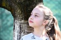 Beauty kid with fresh look and long blond hair. Little girl with young skin on spring or summer day. Child with cute face outdoor. Royalty Free Stock Photo