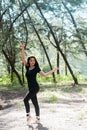 The beauty lady wearing black suit and satin ballet shoes,posing ballet pattern,in forest Royalty Free Stock Photo