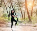 The beauty lady wearing black suit and satin ballet shoes,posint ballet pattern in forest Royalty Free Stock Photo