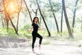 The beauty lady wearing black suit and satin ballet shoes,stepping on ground floor and raise hands up,posing ballet basic pattern, Royalty Free Stock Photo